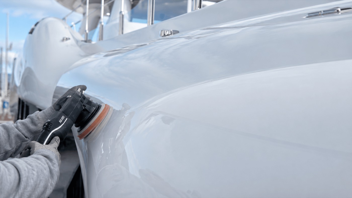 Machine-polishing the bow flare of the 55m Amels.