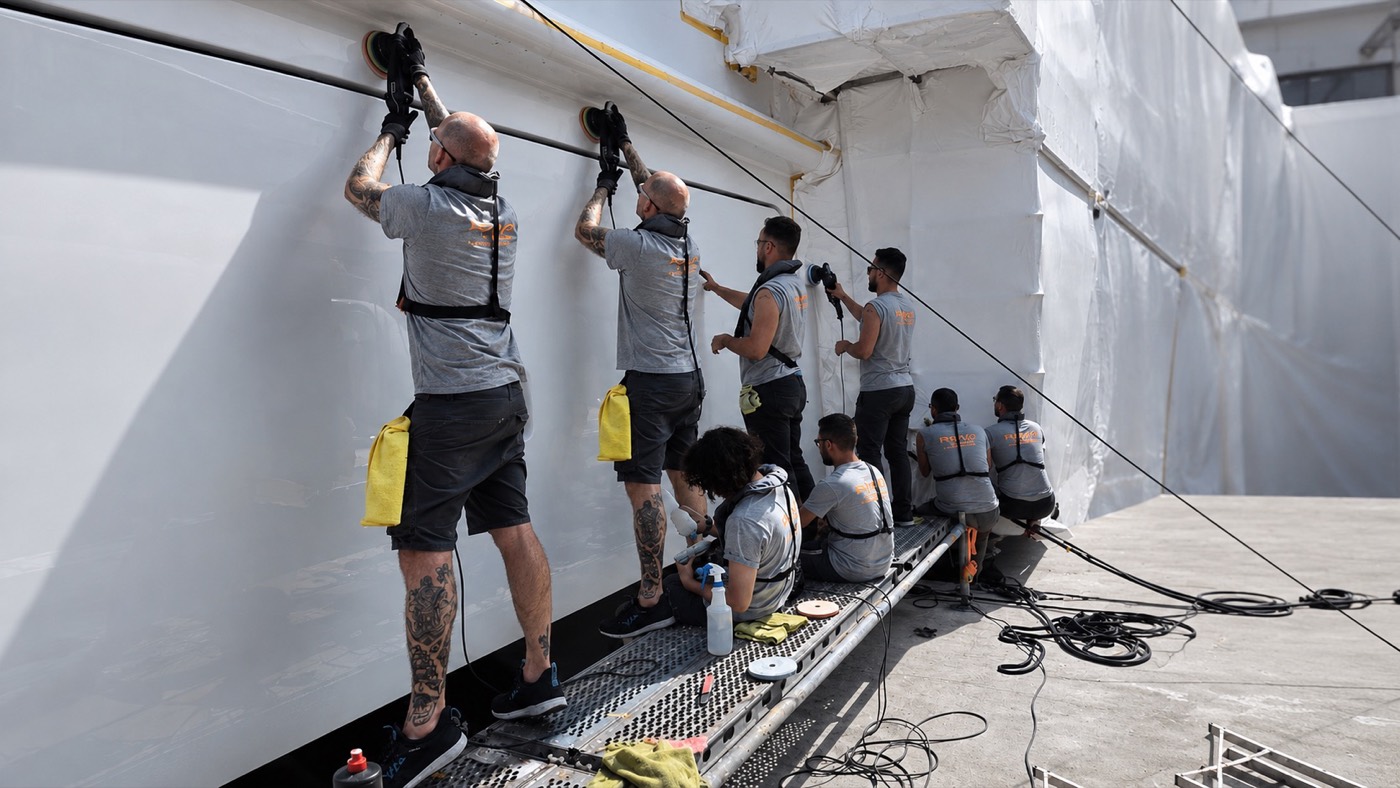 The RMP Marine team working along the hull of the 74m Nobiskrug during its yard period.