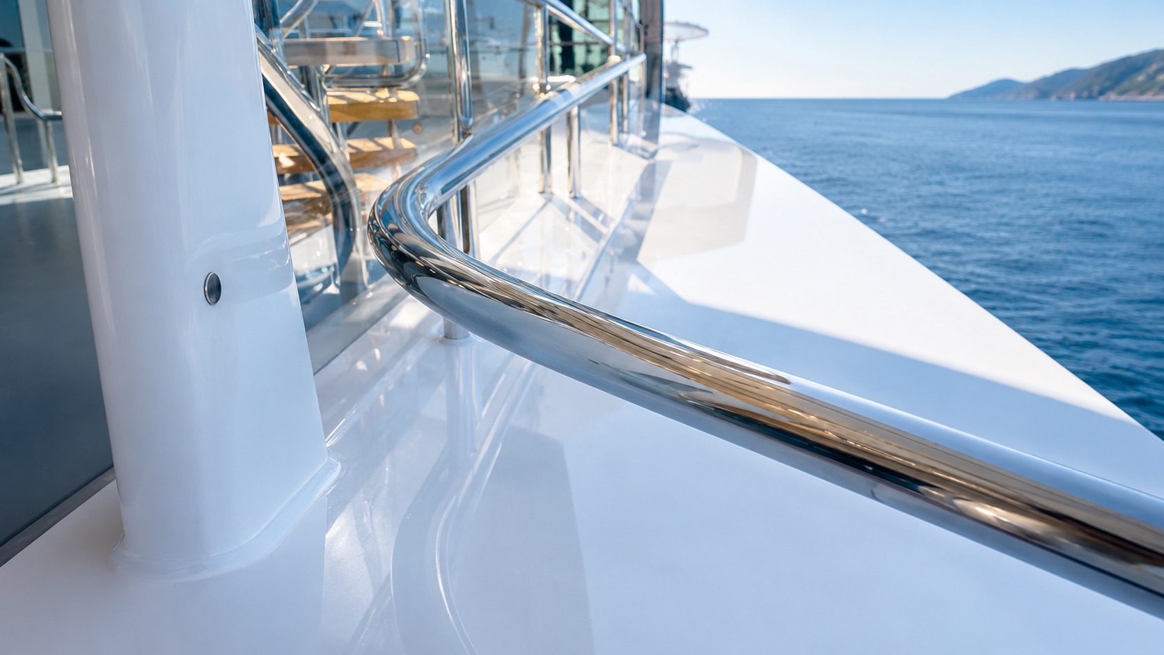 Polished stainless-steel handrail aboard a superyacht.